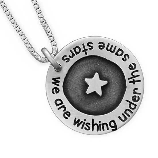 Silver Under the Stars Necklace, with star in the middle engraved in bas relief