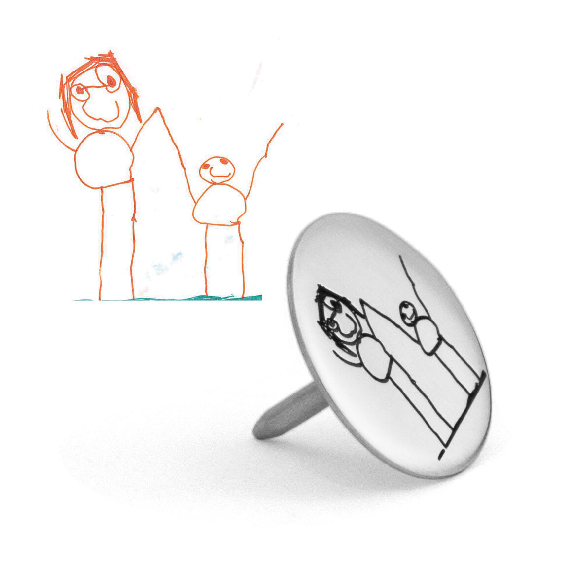 Silver golf marker with kid's drawing of parent and child engraved on it