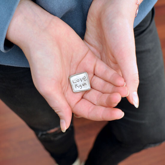 Square Handwriting Pocket Token - Fine Pewter with your handwriting Hands holdingSquare Handwriting Pocket Token made from fine pewter. Token is hand-cast and designed to an organic square with raised edges and your handwriting inscribed