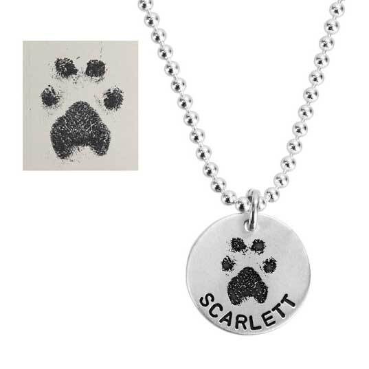 Silver charm necklace dog pawprint on the round silver disc shown with the original pawprint - Heart On Your Wrist 